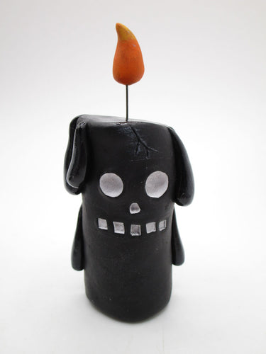 Halloween black candle man with flame