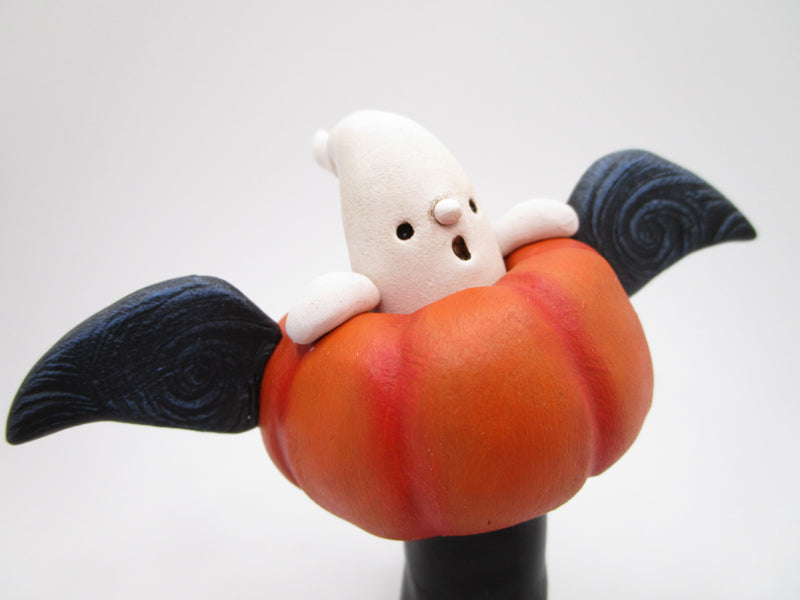 Halloween folk art flying pumpkin with ghost rider 