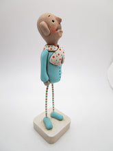 Wacky character "anguish" man in teal and orange