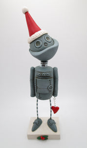 Christmas ROBOT wearing Santa hat with love