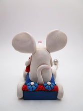 4th of July Mouse on parade wagon with firecracker