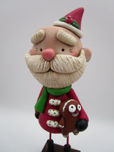 Christmas folk art Santa Claus and his gingerbread man stuffy