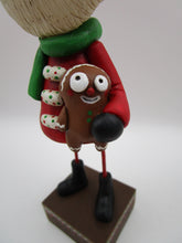 Christmas folk art Santa Claus and his gingerbread man stuffy