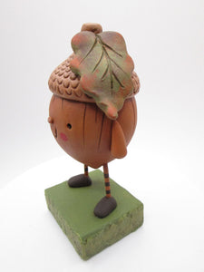 Fall acorn character with big leaf on his head Halloween?