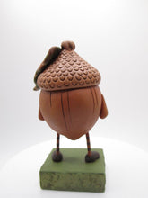 Fall acorn character with big leaf on his head Halloween?