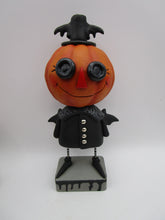 Halloween folk art spooky Pumpkin wearing bat costume