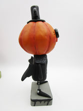 Halloween folk art spooky Pumpkin wearing bat costume