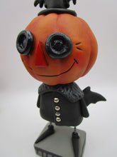 Halloween folk art spooky Pumpkin wearing bat costume