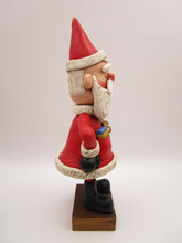 Christmas folk art big Santa Claus with pockets and toys