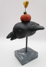 Halloween folk art black bird with pumpkin and heart