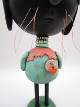 Spring folk art or Easter black bunny retro feel with beads and heart charm