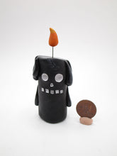 Halloween black candle man with flame