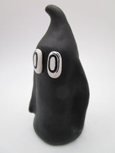 Halloween folk art ghost in black with empty eyes