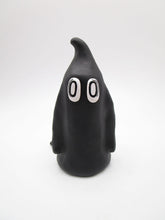 Halloween folk art ghost in black with empty eyes