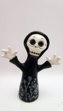 Halloween folk art skeleton ghoul in black cloak with floral doodles