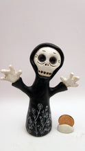 Halloween folk art skeleton ghoul in black cloak with floral doodles