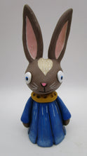Spring folk art brown bunny wearing flower petal dress bluebell