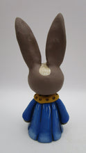 Spring folk art brown bunny wearing flower petal dress bluebell