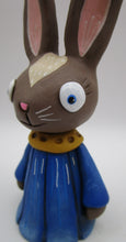 Spring folk art brown bunny wearing flower petal dress bluebell