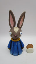Spring folk art brown bunny wearing flower petal dress bluebell