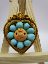 Spring folk art blue flower character in an ornate frame