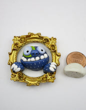 Monster art gilded gold frame with blue monster and wacky teeth