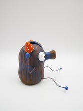 Monster folk art dark blue and orange snoot monster with bendable arms and legs