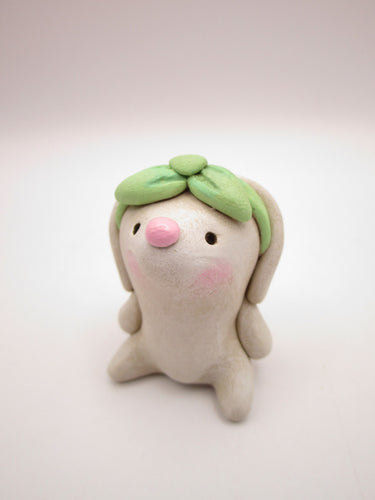 Spring folk art or Valentine little bunny with mint bow