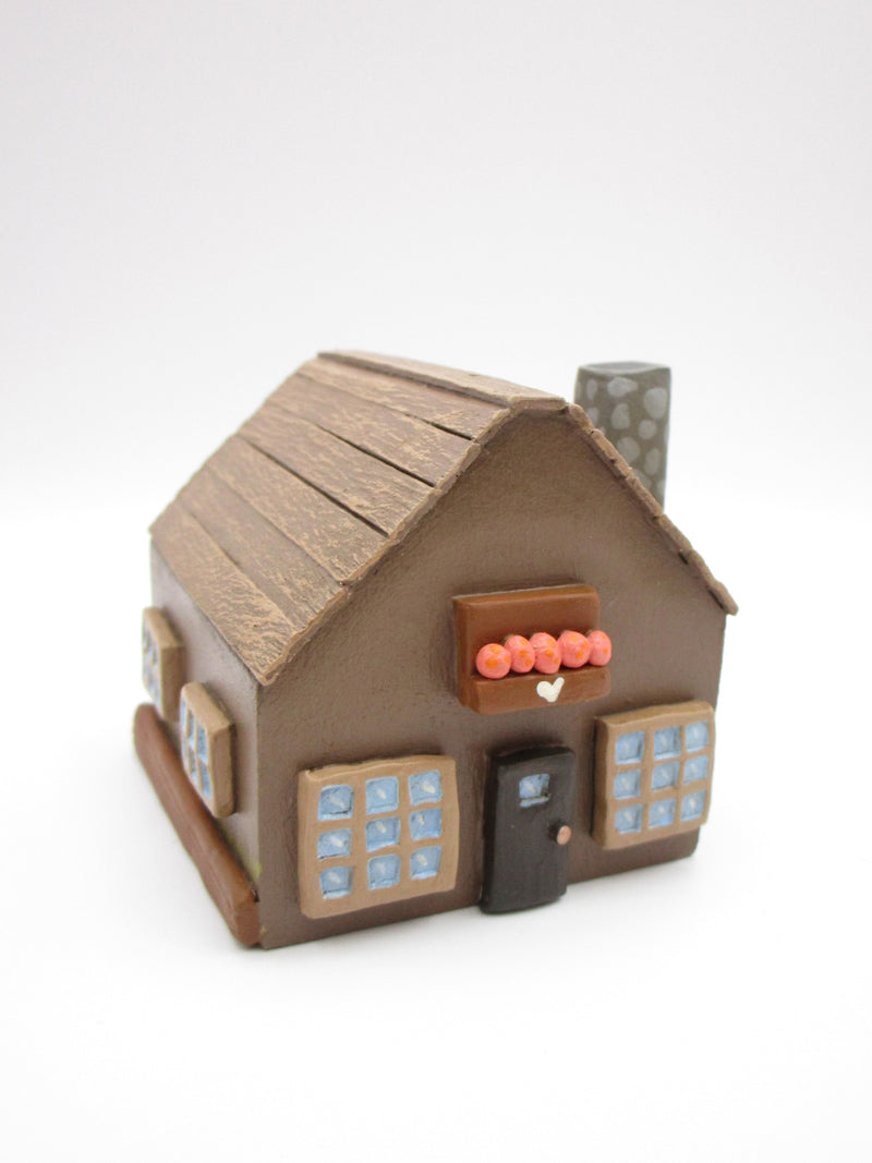 Wood house brown with windows shrubs and chimney  misc