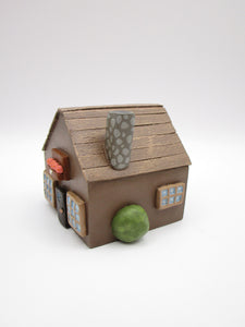 Wood house brown with windows shrubs and chimney  misc