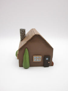 Wood house brown with windows shrubs and chimney  misc