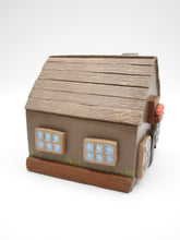 Wood house brown with windows shrubs and chimney  misc