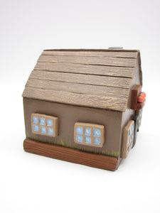 Wood house brown with windows shrubs and chimney  misc