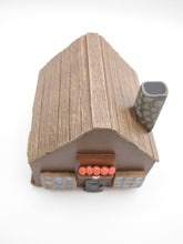 Wood house brown with windows shrubs and chimney  misc