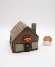 Wood house brown with windows shrubs and chimney  misc