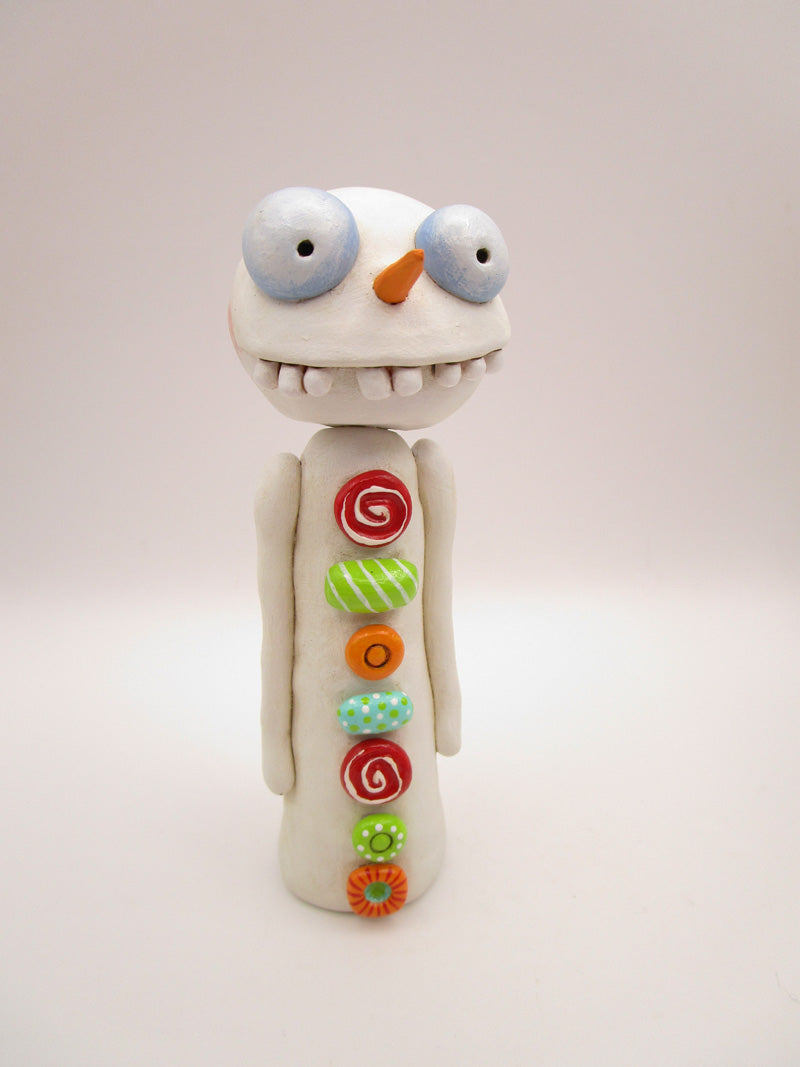 Christmas folk art wacky snowman with wacky teeth and lots of crazy buttons