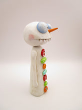Christmas folk art wacky snowman with wacky teeth and lots of crazy buttons