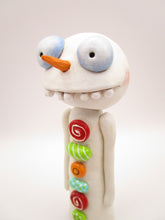 Christmas folk art wacky snowman with wacky teeth and lots of crazy buttons
