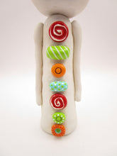 Christmas folk art wacky snowman with wacky teeth and lots of crazy buttons