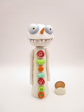 Christmas folk art wacky snowman with wacky teeth and lots of crazy buttons