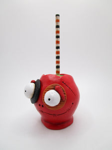 Halloween red candy apple character with big eyes and eye patches