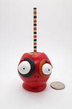 Halloween red candy apple character with big eyes and eye patches