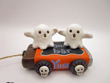 Halloween folk art two ghosts on a "pull" toy candy bar