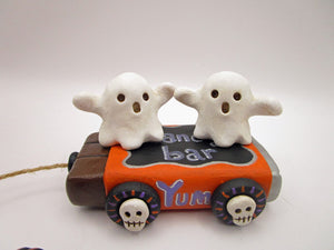 Halloween folk art two ghosts on a "pull" toy candy bar
