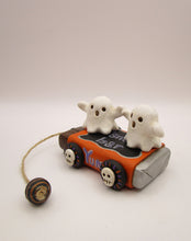 Halloween folk art two ghosts on a "pull" toy candy bar
