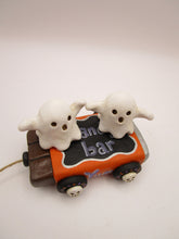Halloween folk art two ghosts on a "pull" toy candy bar