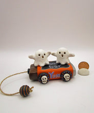 Halloween folk art two ghosts on a "pull" toy candy bar