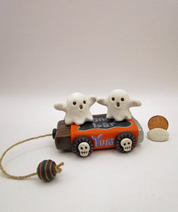 Halloween folk art two ghosts on a "pull" toy candy bar