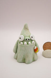 Halloween folk art monster zombie like ghost with candy corn