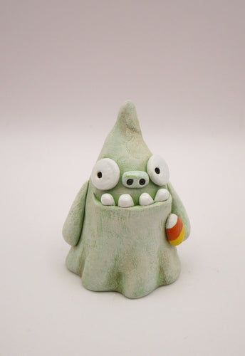 Halloween folk art monster zombie like ghost with candy corn
